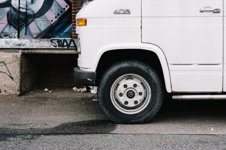 van-parked-by-old-building_1048944-28737149